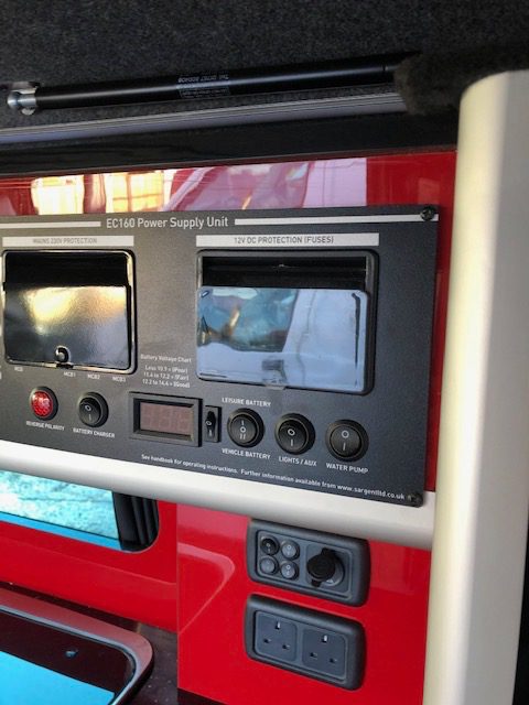 inside a red van conversion by The Dub Hut (Ashford) Ltd