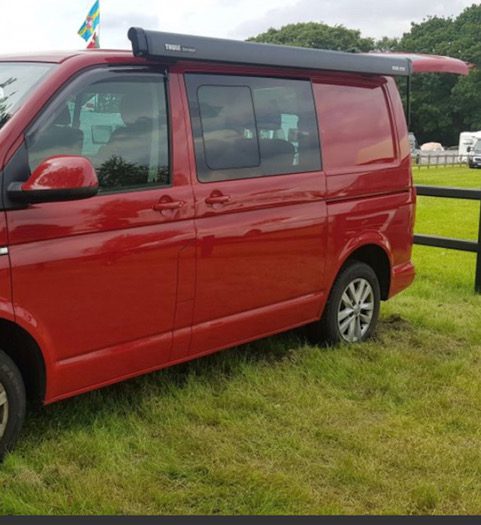 red campervan conversion with awning