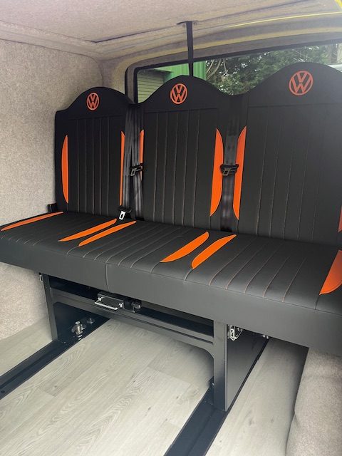 orange and black VW logo Full width R&R fabworx bed on rails