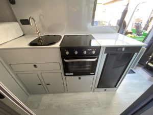 large-campervan-conversion-kitchen-kent-cream-ivory-sink-hob-kitchen
