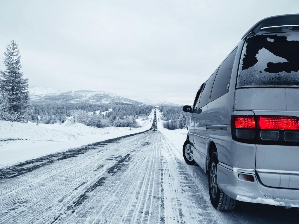 silver van on a snowy road